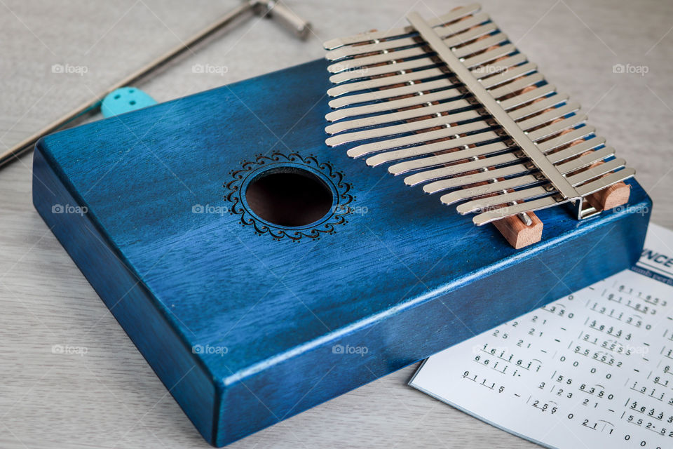 Musical set up with blue kalimba, close-up