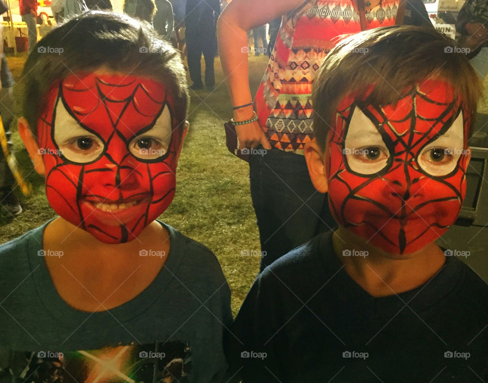 Which 1 is the real Spider-Man. Two young masked boys giggle before I shot their photo! I don't know who they are as they ran off after the photo!