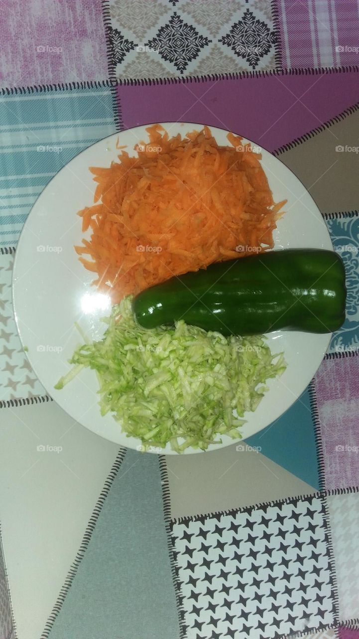 Pumpkins and carrots in a dish and pepper.