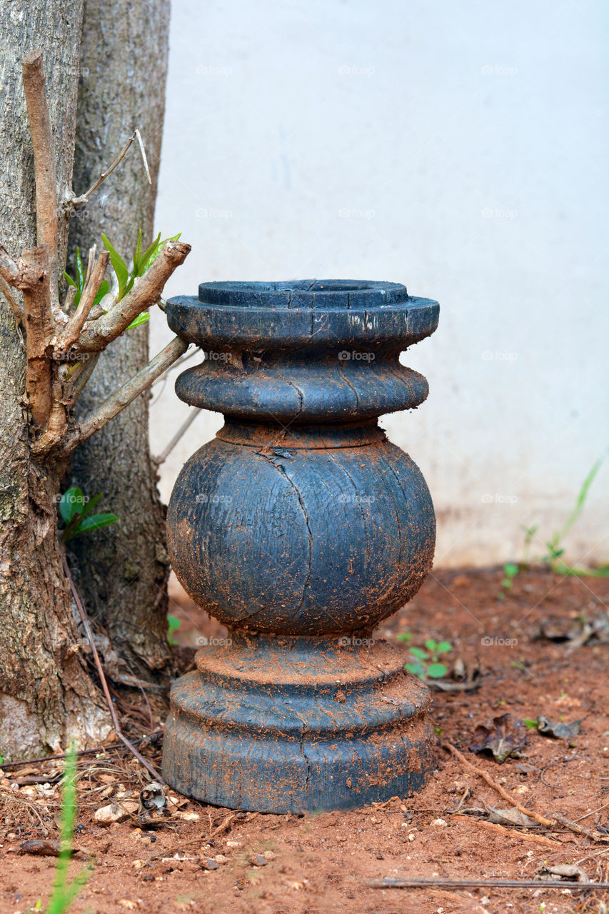 Old wood vase in the garden.