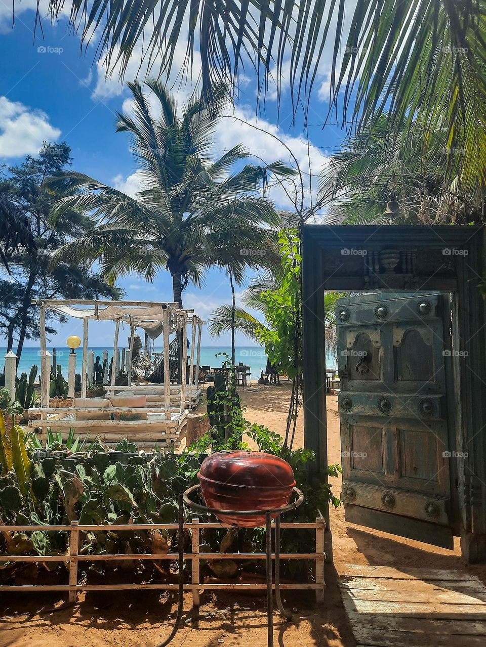 Relaxation under the coconut trees with delicious food and drinks around on a summer holiday. Gorgeous beaches with golden sand and blue waters.