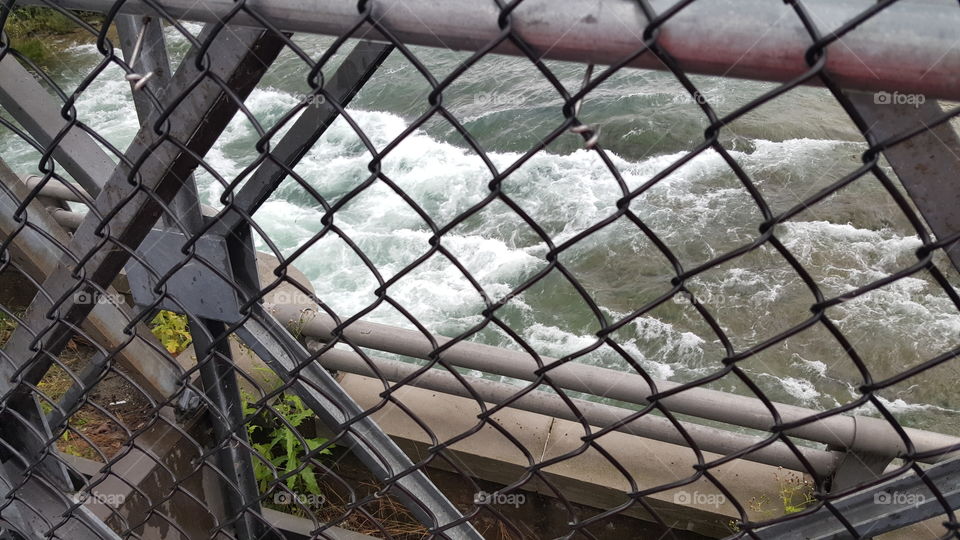 The angry waters of Niarga bustling under the bridge.