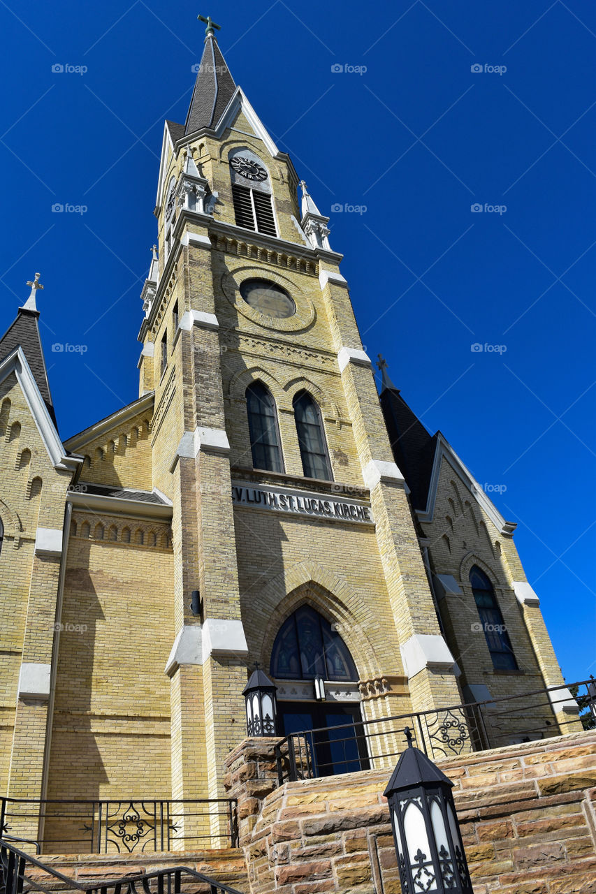 Church steeple against a blue sky