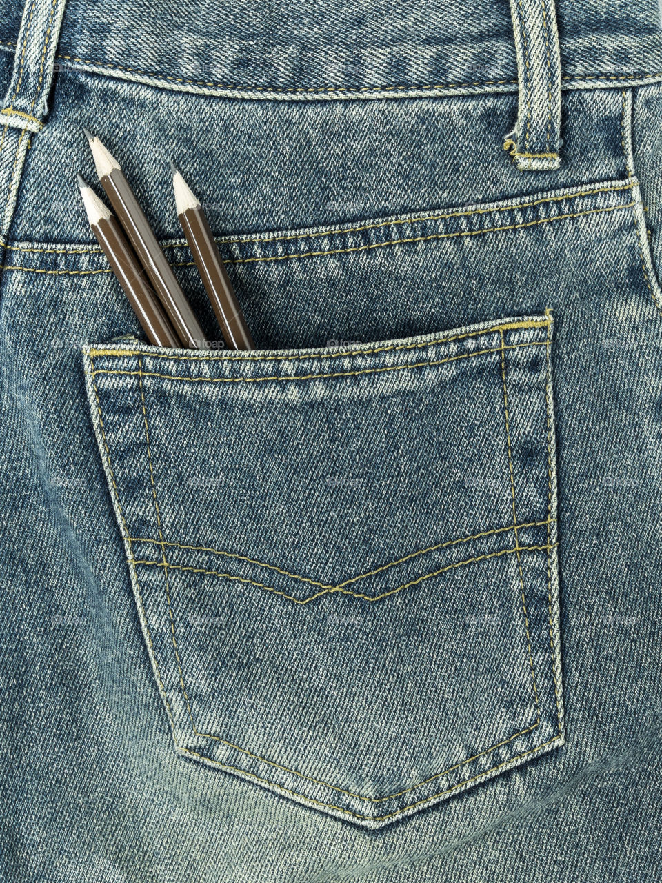 Pencils in jeans pocket