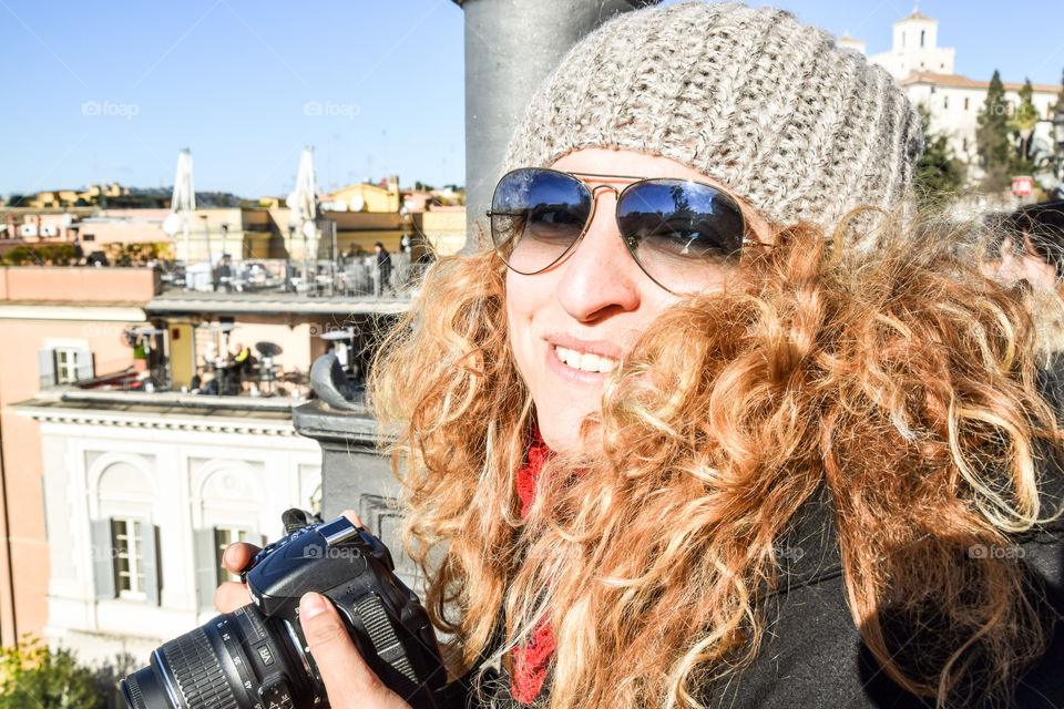 Beautiful Happy Smiling Blonde Young Woman Photographer Wearing Sunglasses And Cap
