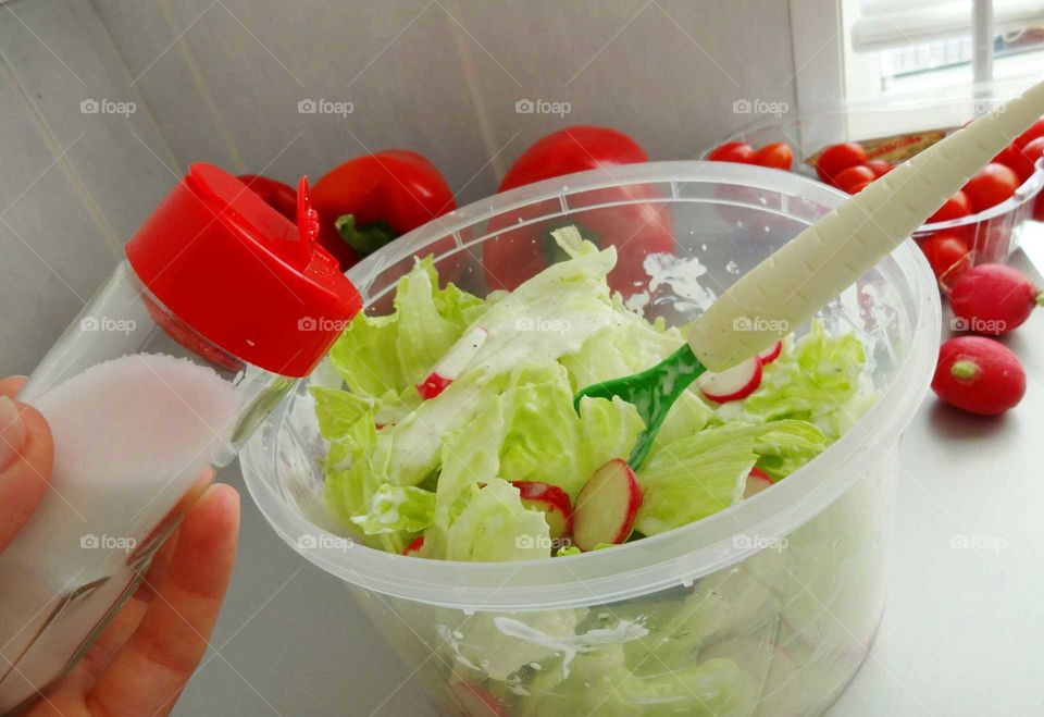 Woman preparing salad