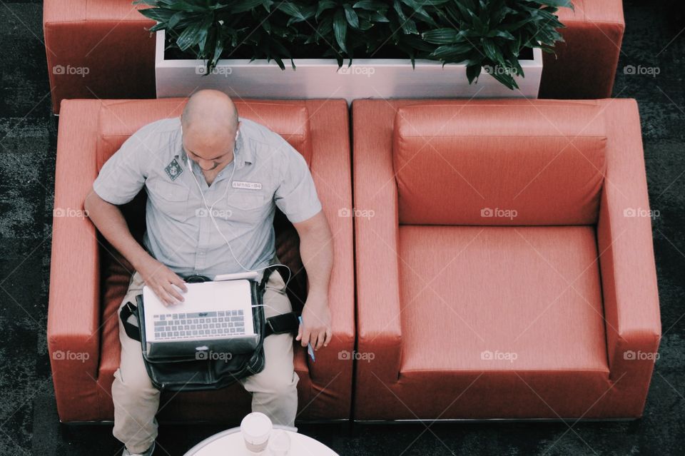 Using laptop in office lobby 