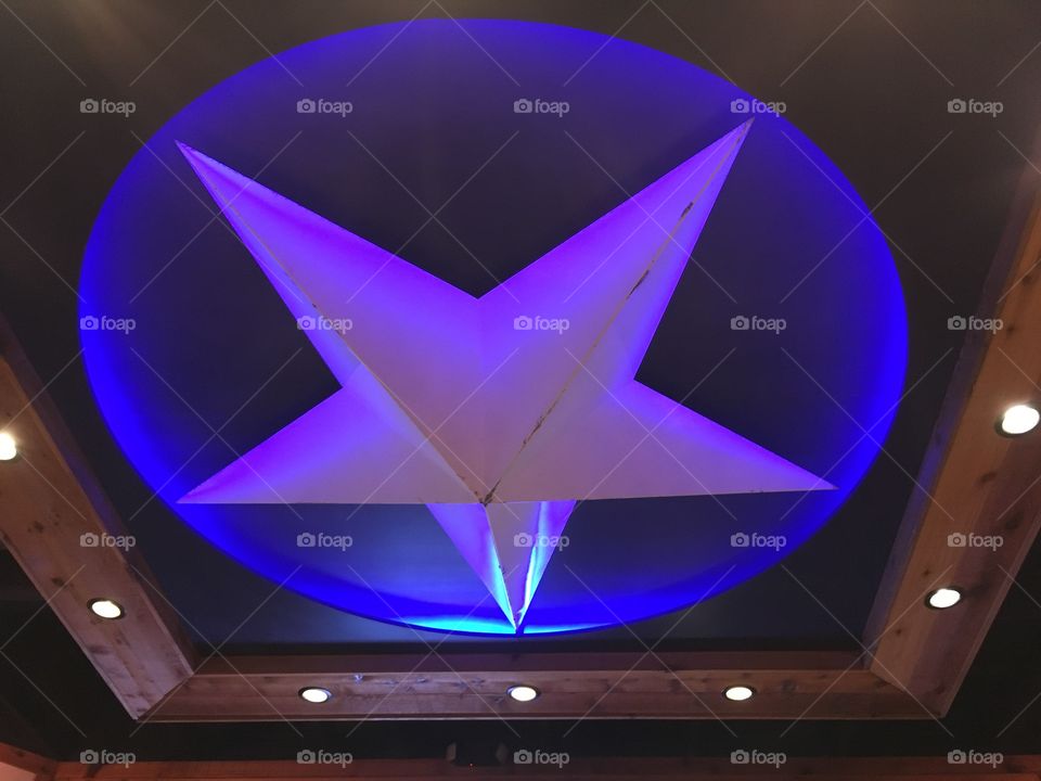 White star back lit with blue