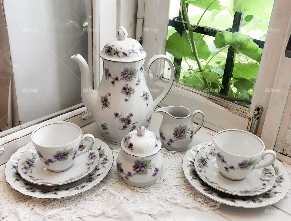 Old porcelain service with violets patterns 