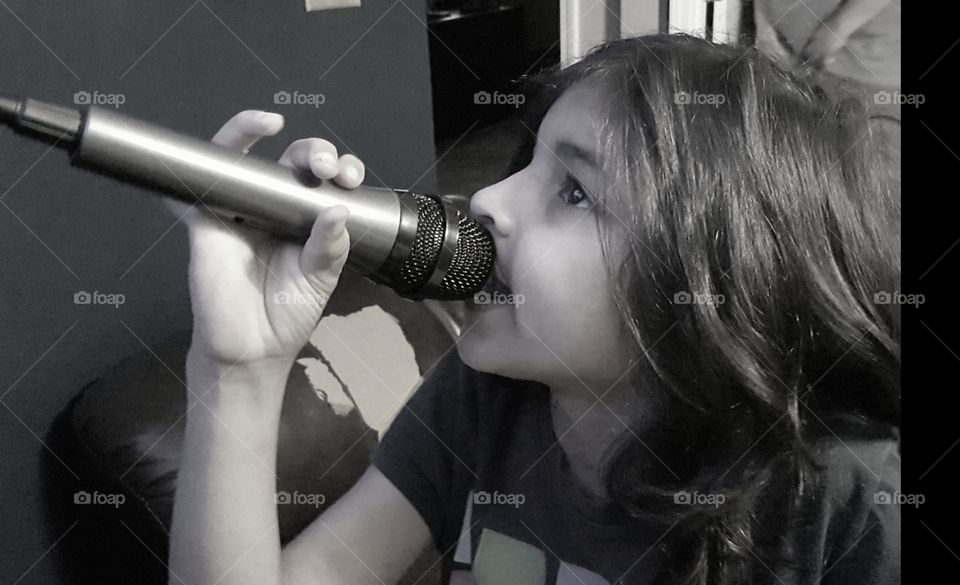 Girl singing with using mic