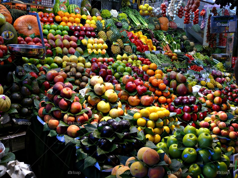 Variety of fruits at market stand.