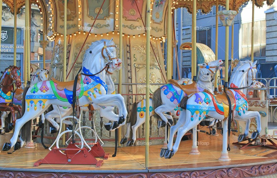 Merry-go-round.  blue wood horses