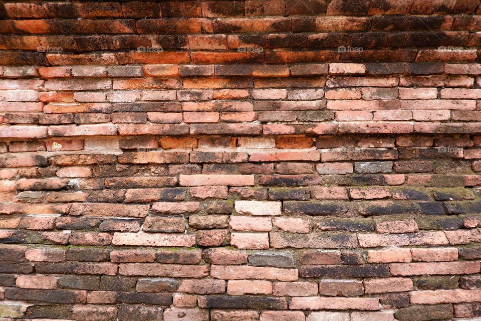Ancient red brick wall texture in Thailand