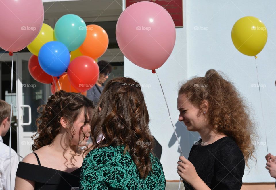 colour balloons in the hands people