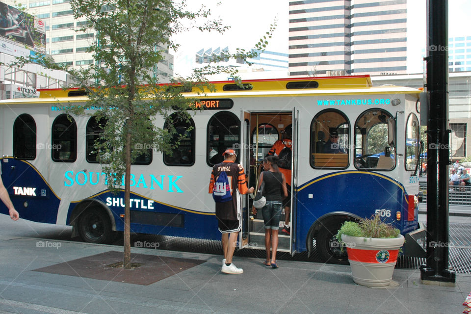 Bengals Fans are getting on board public shuttle in Downtown of Cincinnati 