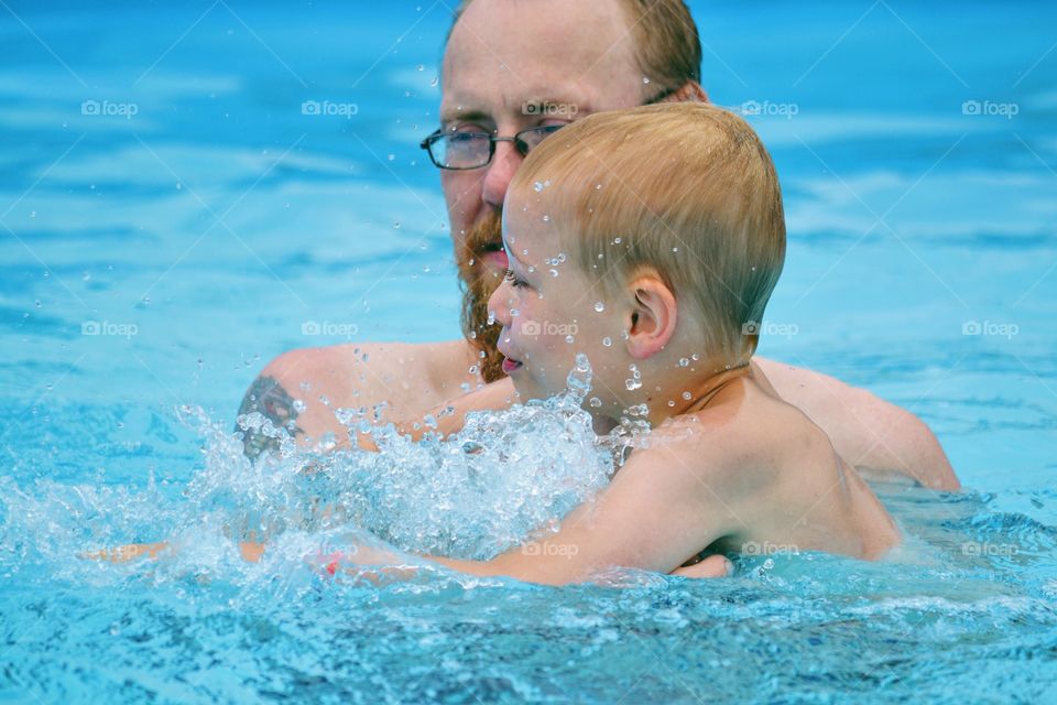 Father and son in the pool