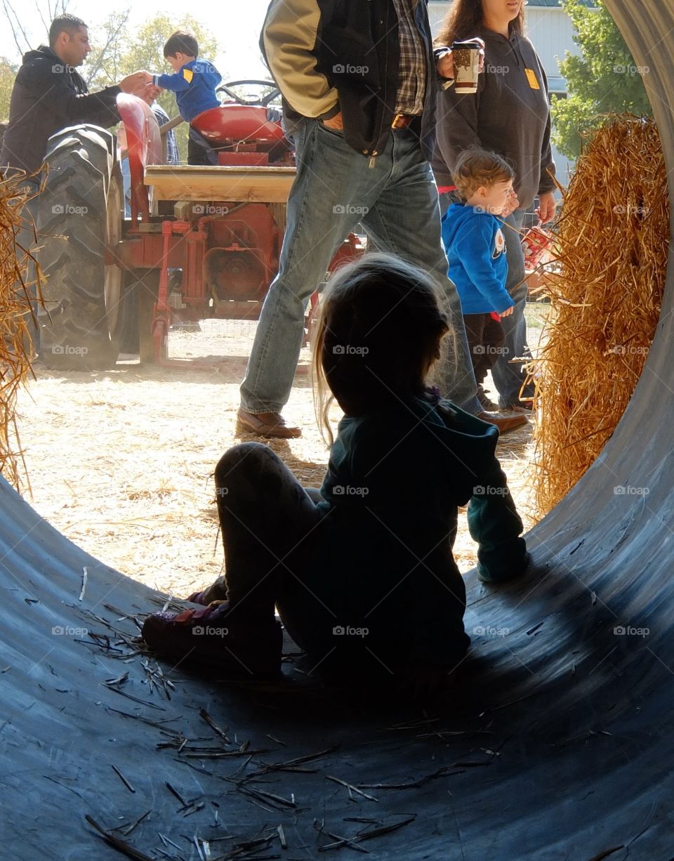 sillhouette of child at at a Midwest pumpkin patch