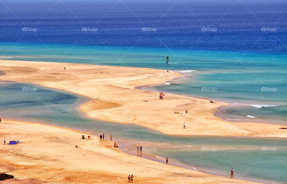 beautiful sotavento beach and windsurfers in the atlantic ocean on fuerteventura canary island in spain