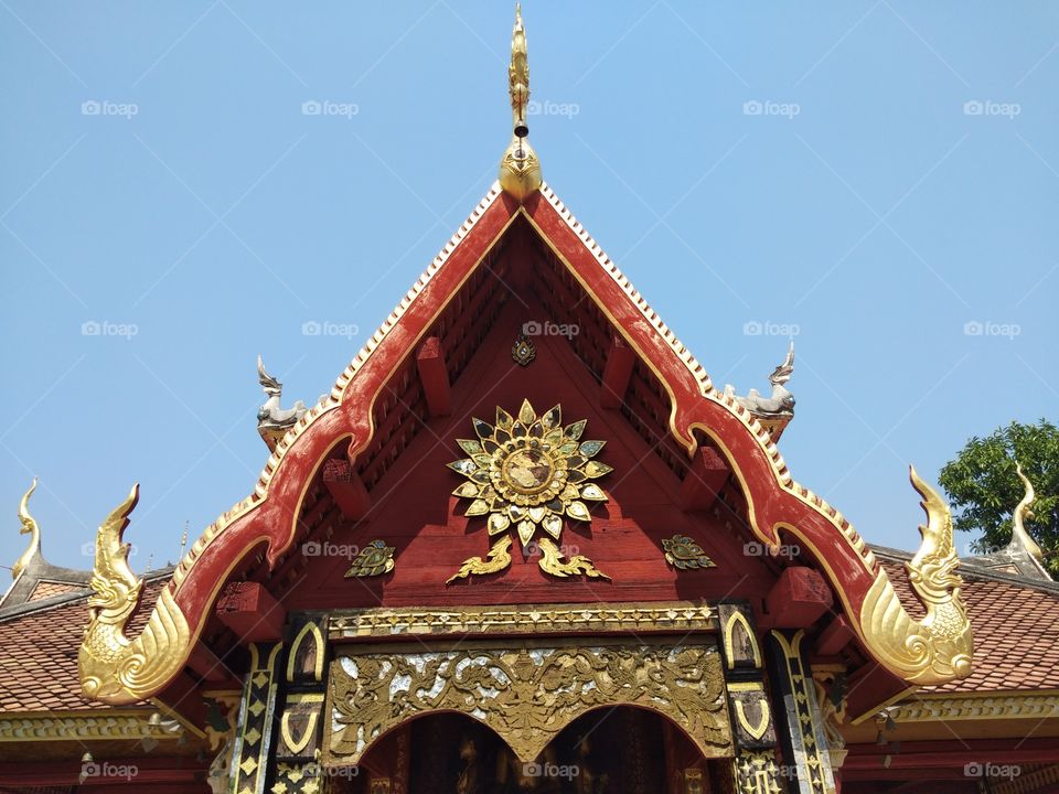 The beautiful roof and the gable which  northern Thai style of Wat Pong Sanook the old temple in Lampang province.