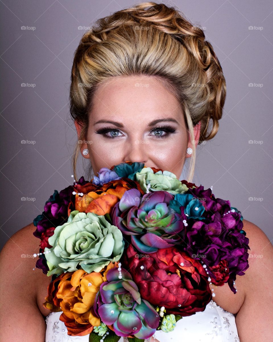 Close-up of bridal with bunch of flowers