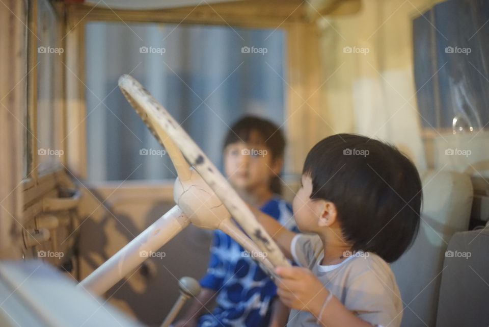 Children driving a truck