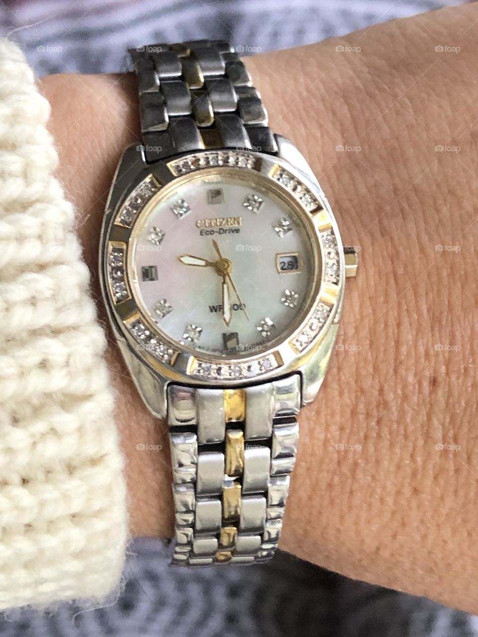 Wearing beautiful eco friendly solar Citizen watch with diamonds and mother of pearls faceplate 
