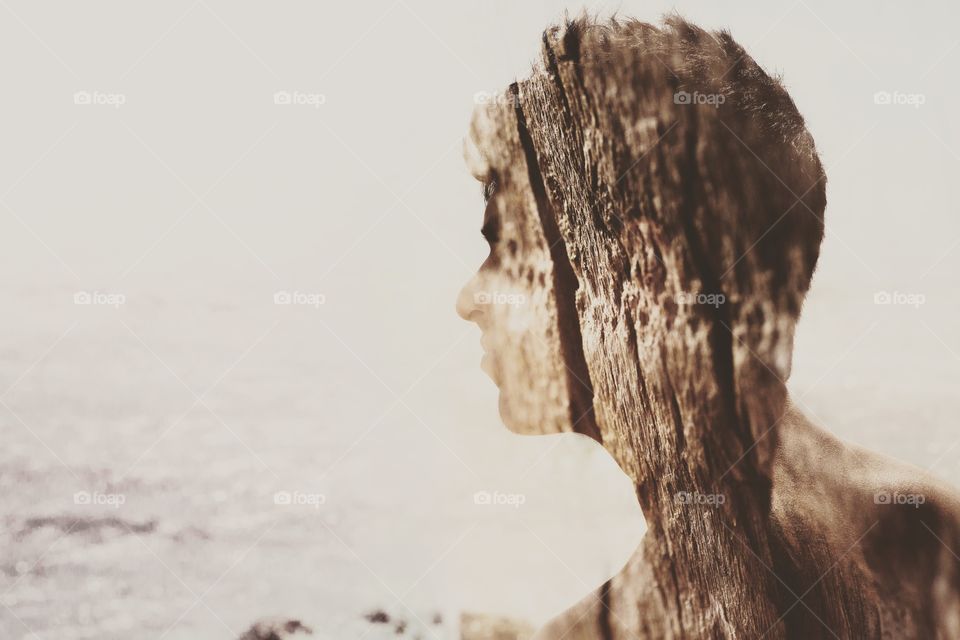 Amazing double exposure of a man's profile and macro shot of wood