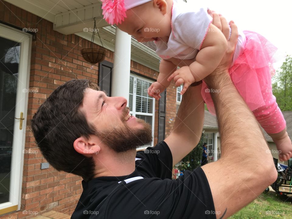 Close-up of happy father and daughter