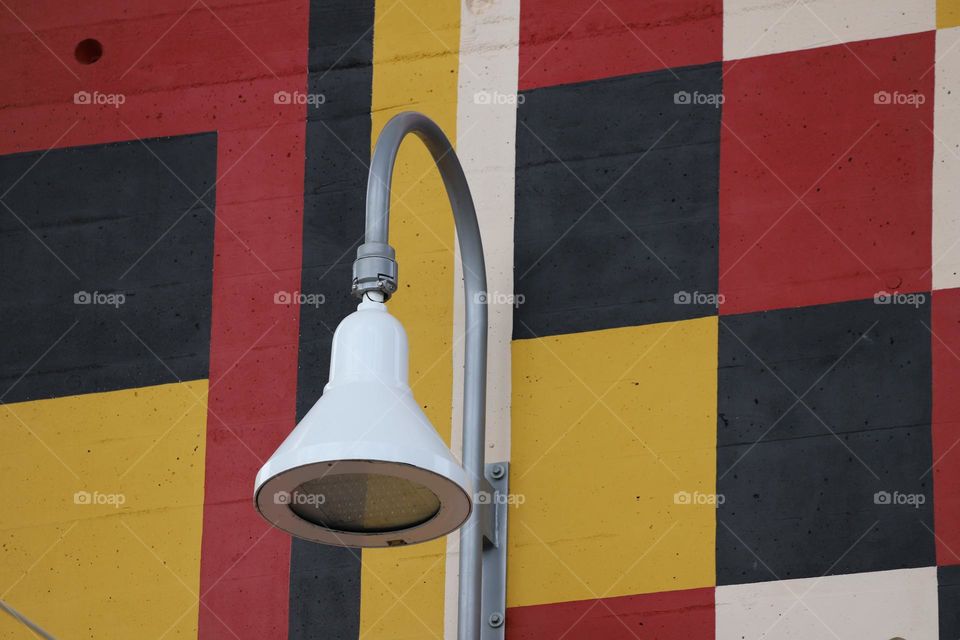 Lamp on colorful wall