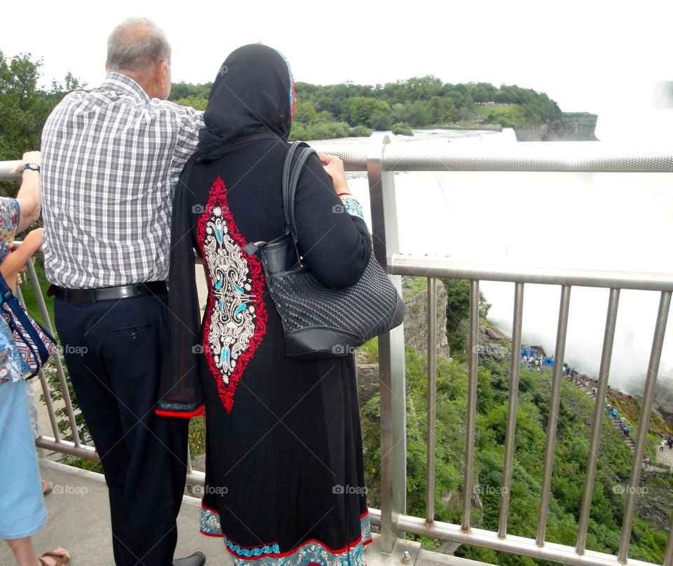 Elderly couple sight seeing at Niagara falls