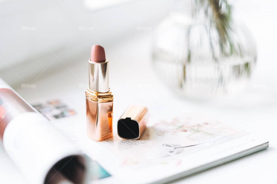 Makeup products on window sill