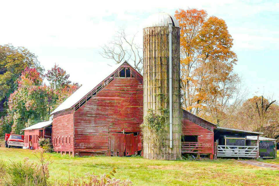 old red barn with silo and antique truck