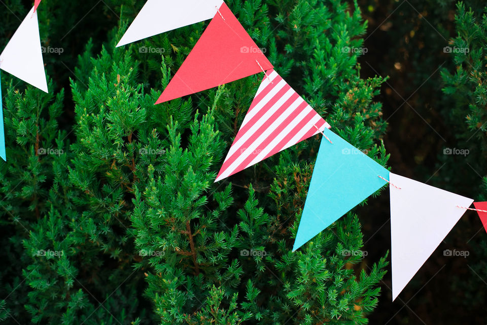 Triangular flags hanging at outdoors