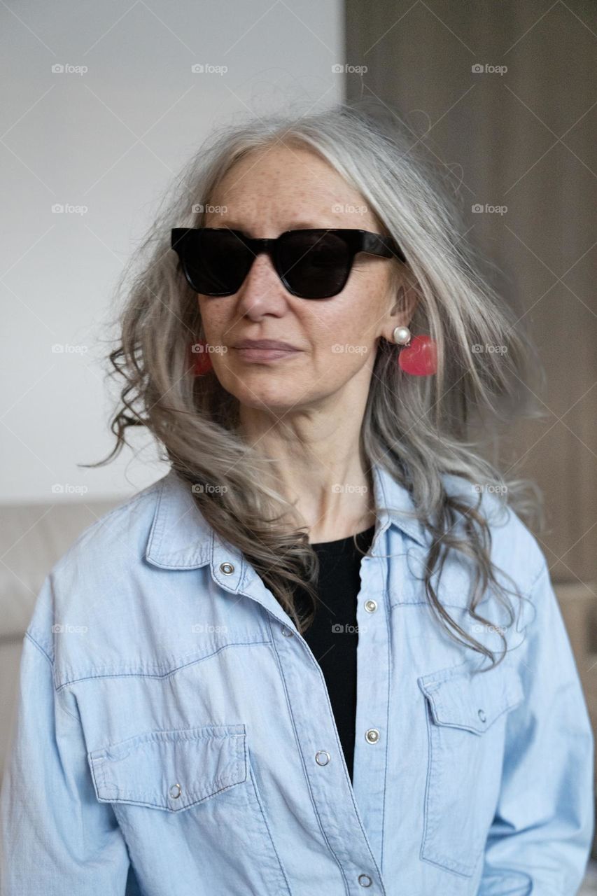 Silver hair woman wearing sunglasses 
