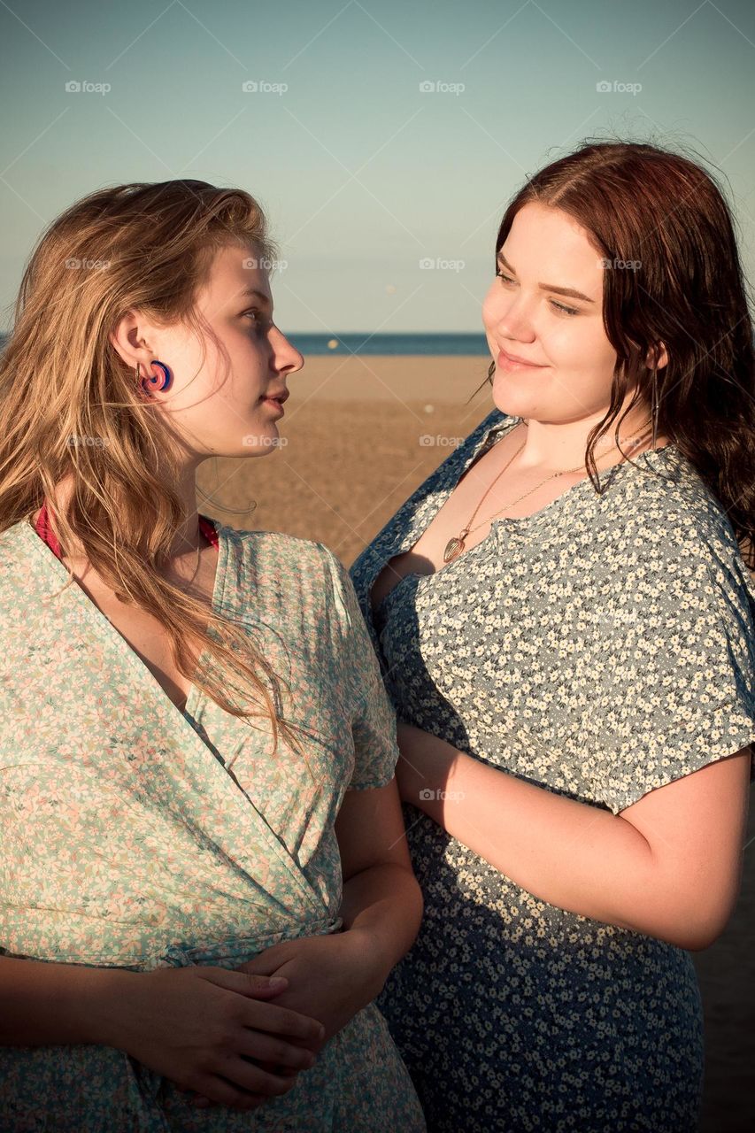 two women looking into each other s eyes, smiling