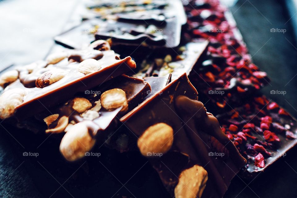 Nuts, fruits and berries in tasty chocolate 