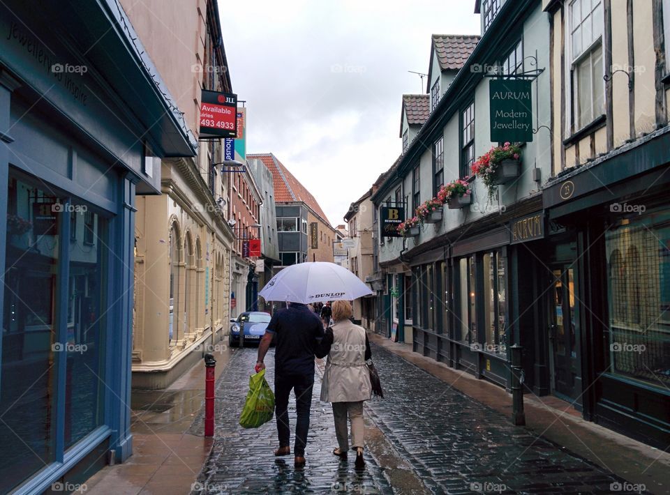 Rain in Norwich - couple with umbrella