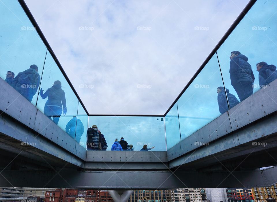 Photo taken under a bridge ... love the turquoise glass and seeing people taking in views of the river 