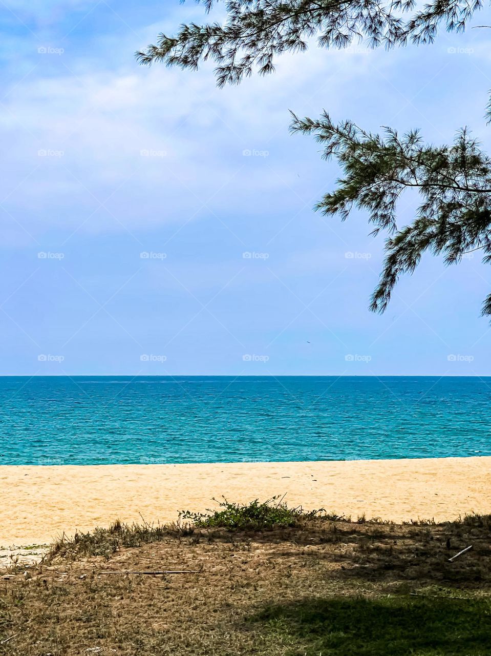 View of an emerald sea by the beach. Holiday feels 