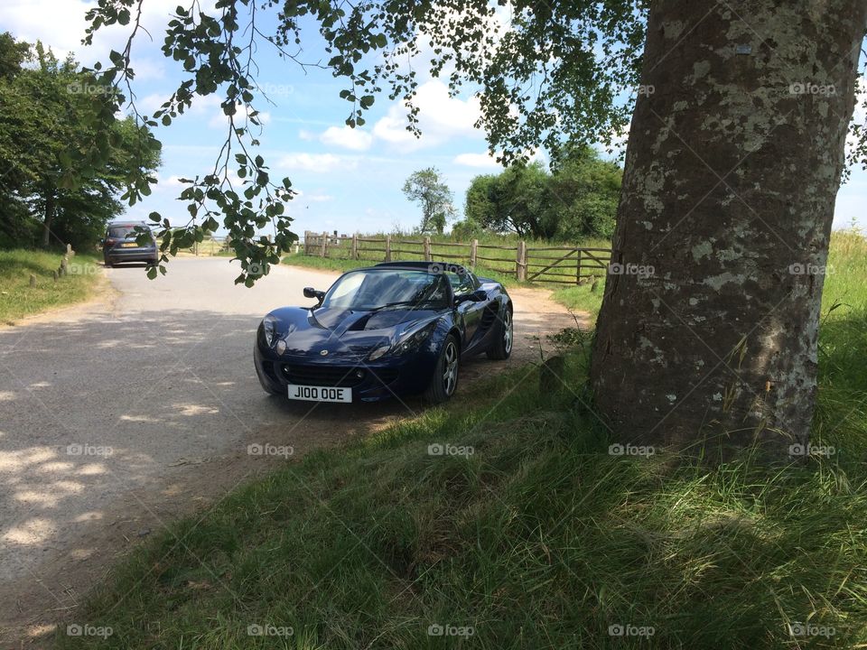 Super car lifestyle . Sports car in the countryside 