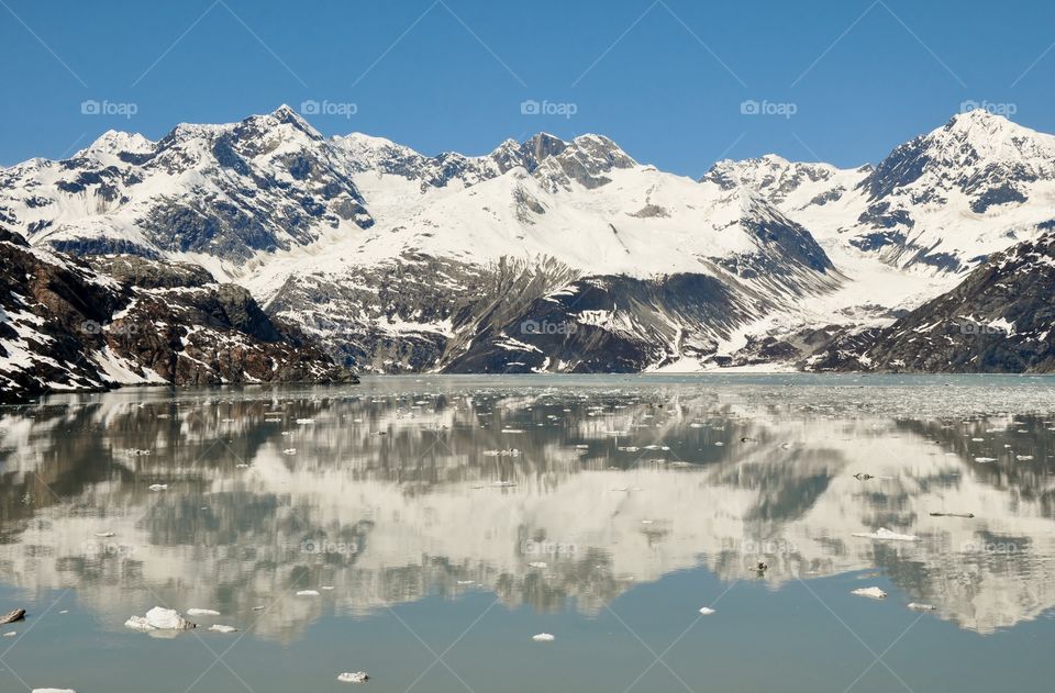 Reflection of rocky mountain on lake
