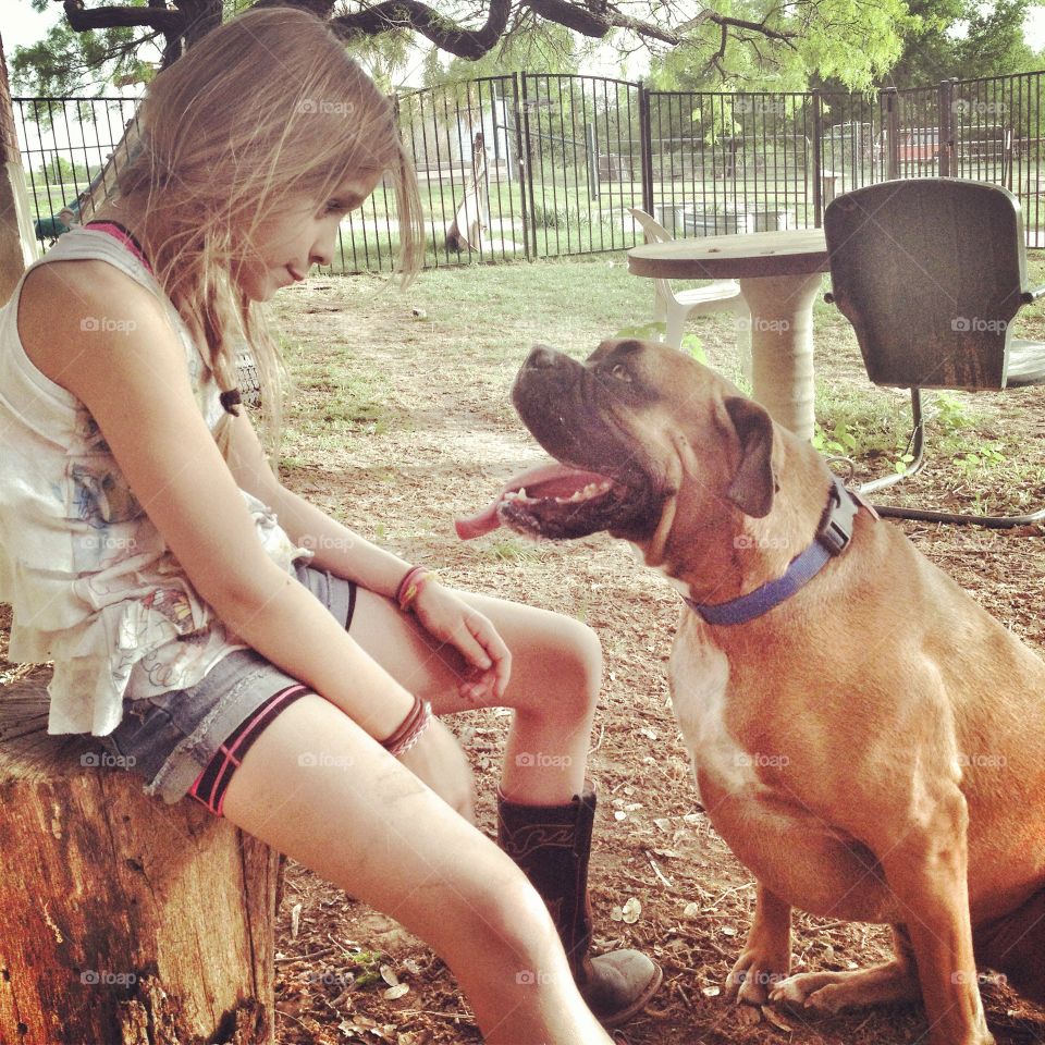 Girl with boxer dog 