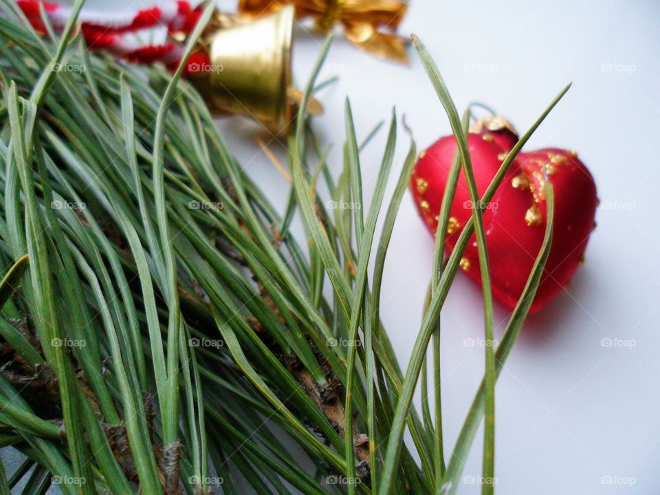 Christmas balls and pine branches on a white background