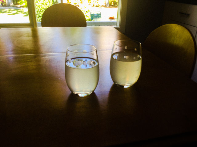 Sunlight shining through the glasses of water 