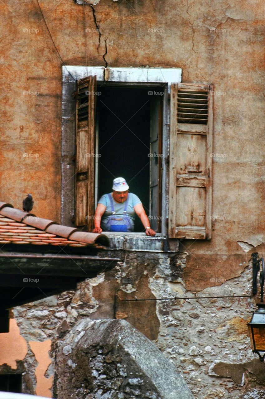 fat man in a window