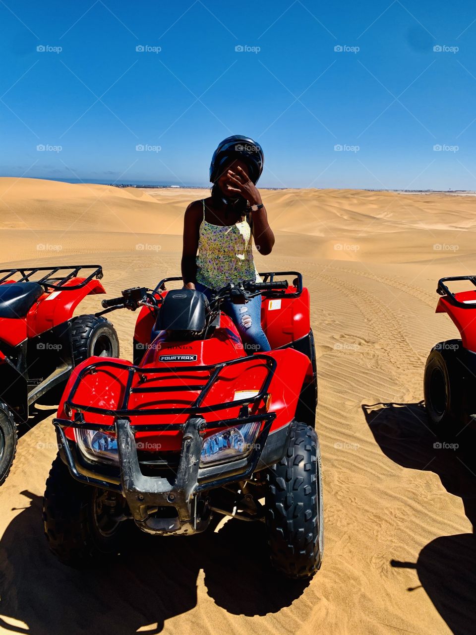 Quad biking on the dunes on a hot sunny day.