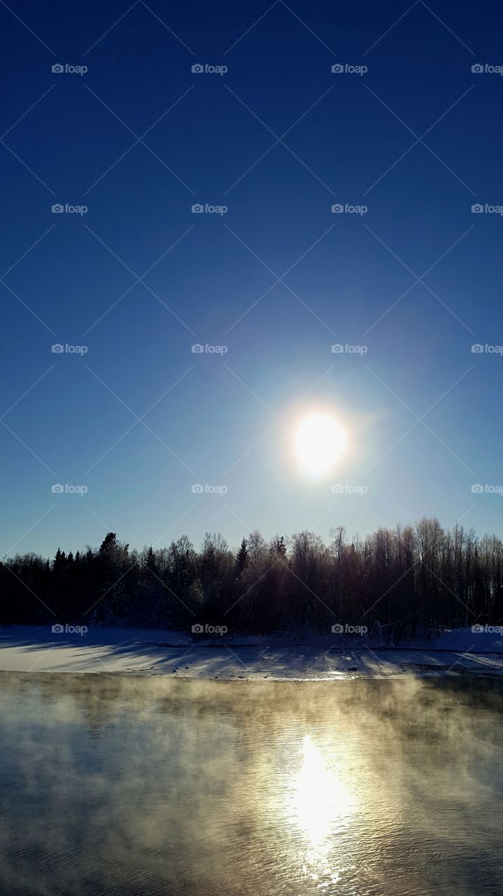 Beautiful day in winter......sun fog and open water