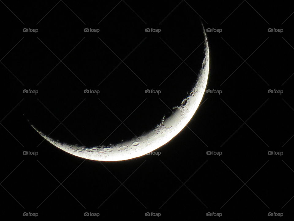 Close-up of the moon as a crescent shape.