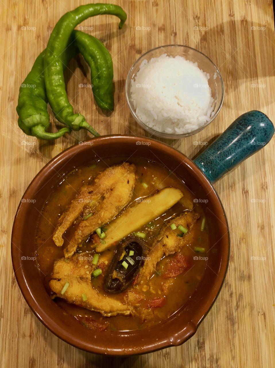 A traditional India delicacy - Home made fish curry with mustard gravy & white rice 