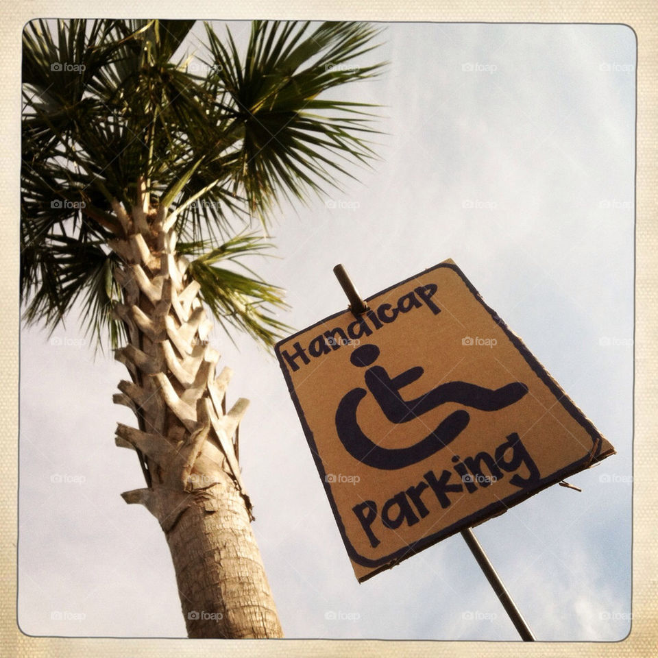 Handicap parking sign at the beach.